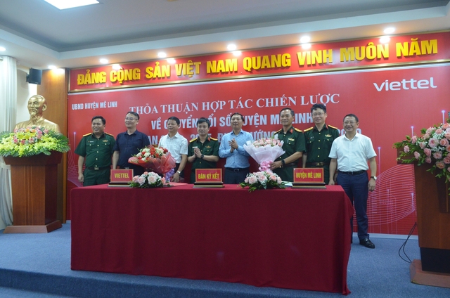 Lễ ký kết hợp tác về chuyển đổi số giữa huyện Mê Linh và Viettel Hà Nội - Ảnh 1.
