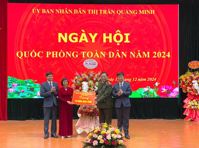 Giám đốc công an thành phố Hà Nội Nguyễn Hải Trung dự ngày hội Quốc phòng toàn dân tại thị trấn Quang Minh, huyện Mê Linh- Ảnh 1. Giám đốc công an thành phố Hà Nội Nguyễn Hải Trung dự ngày hội Quốc phòng toàn dân tại thị trấn Quang Minh, huyện Mê Linh- Ảnh 1.